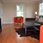 Spacious livingroom with lots of natural light.