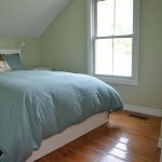 The second cozy bedroom also has a double bed, slanted ceiling and original wide plank pine floors.