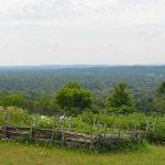 Raised beds for potato plants - and the vista beyond from Clelo Farm.